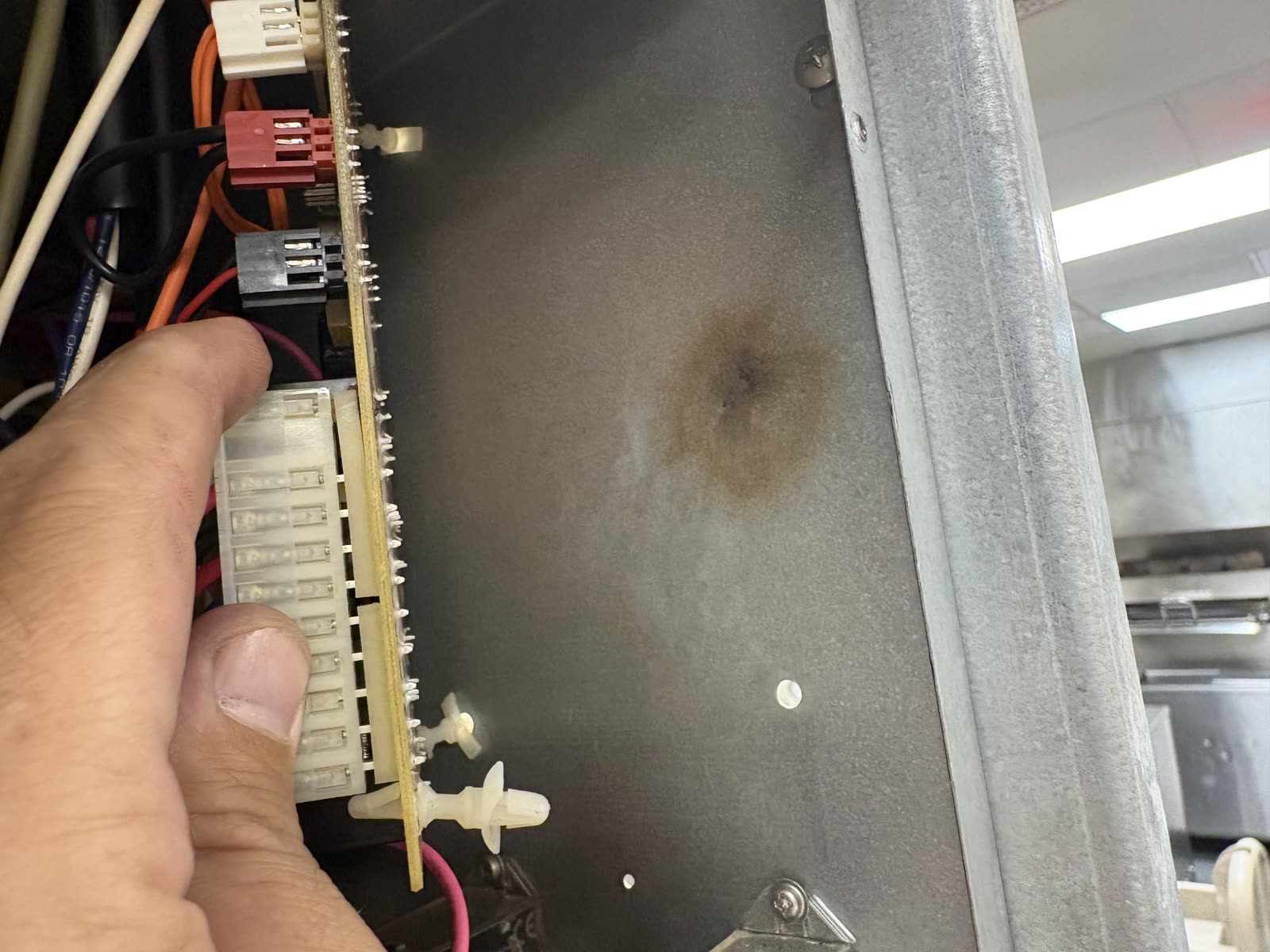 Interior of an ice machine cabinet before a full cleaning